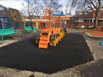 Existing train play equipment and benches at Little Dorrit Park